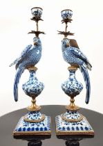 CANDLESTICKS, a pair, blue and white gazed ceramic gilt metal mounts, 49cm high. (2)