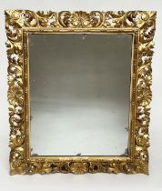 FLORENTINE WALL MIRROR, late 19th/early 20th century Florentine carved giltwood, 90cm H x 74cm W.