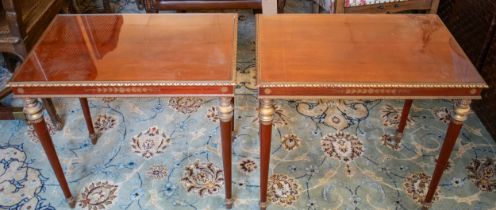 LOW TABLES, a pair, Brazilian mahogany with gilt detail and inset glass tops, each 42cm x 62cm x