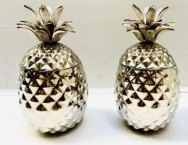 ICE BUCKETS, in the form of pineapples, polished metal, 33cm high, 20cm diameter. (2)