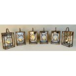 WALL HANGING CANDLE LANTERNS, a set of six, Art Deco style, mirrored backs, 43cm x 22cm x 11cm. (6)