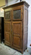 ARMOIRE, 226cm H x 142cm x 58cm, early 19th century French oak with a pair of tole panel doors above