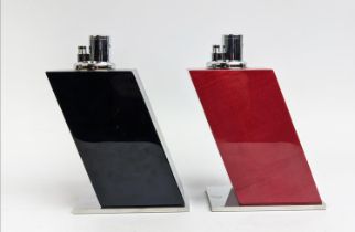 ELIE BLEU OF PARIS TABLE LIGHTERS, a pair, one in black, the other in a red dyed sycamore finish,