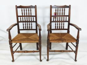 SPINDLE BACK CHAIRS, a set of six, including two carvers, 19th century oak with rush seats,