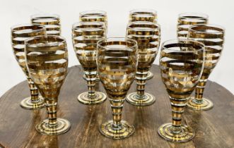 GLASSES, a set of ten, 1950's style gold stripe marked M.A.P. to base. (10)