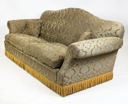 SOFA, Victorian design with camel back and scroll arms, upholstered in gold cut velvet and bullion