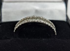 AN 18CT WHITE GOLD DIAMOND HALF ETERNITY RING, channel set row of diamonds with diamond set