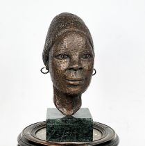 BUST OF AN AFRICAN LADY, bronzed on marble plinth stand, initialed GSTH and dated 1973 to verso,