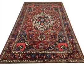 ANTIQUE PERSIAN BAKHTIYAR CARPET, 333cm x 222cm.