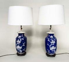 TABLE LAMPS, a pair, mid 20th century Chinese white on indigo blue ceramic with height adjustable