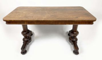 LIBRARY TABLE, late Regency rosewood, circa 1830, with central drawer on octagonal end supports with