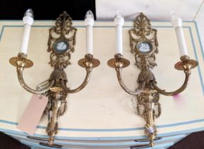 WALL APPLIQUES, a pair, brass with cameo detail, each 57cm H x 33cm. (2)