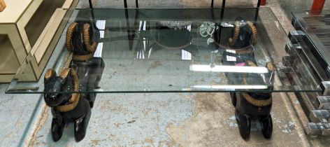 LOW TABLE, 120cm x 70cm x 34cm, carved and painted ram supports, bevelled glass top.