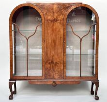 ART DECO DISPLAY CASE, burr walnut with two glazed arched panelled doors, enclosing shelves, 117cm W