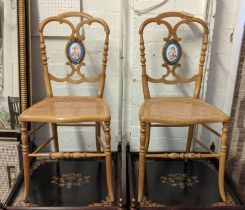 SALON CHAIRS, a pair, beechwood with decorative porcelain plaques depicting cupids, each 41cm W with