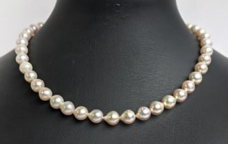 CULTURED PEARL SINGLE STRAND NECKLACE, each pearl of round irregular form, 8mm diam approx, 14ct