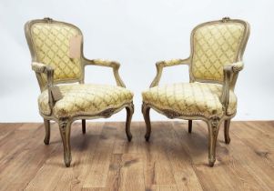 CHILD'S FAUTEUILS, a pair, 19th century French grey painted in primrose yellow patterned upholstery,