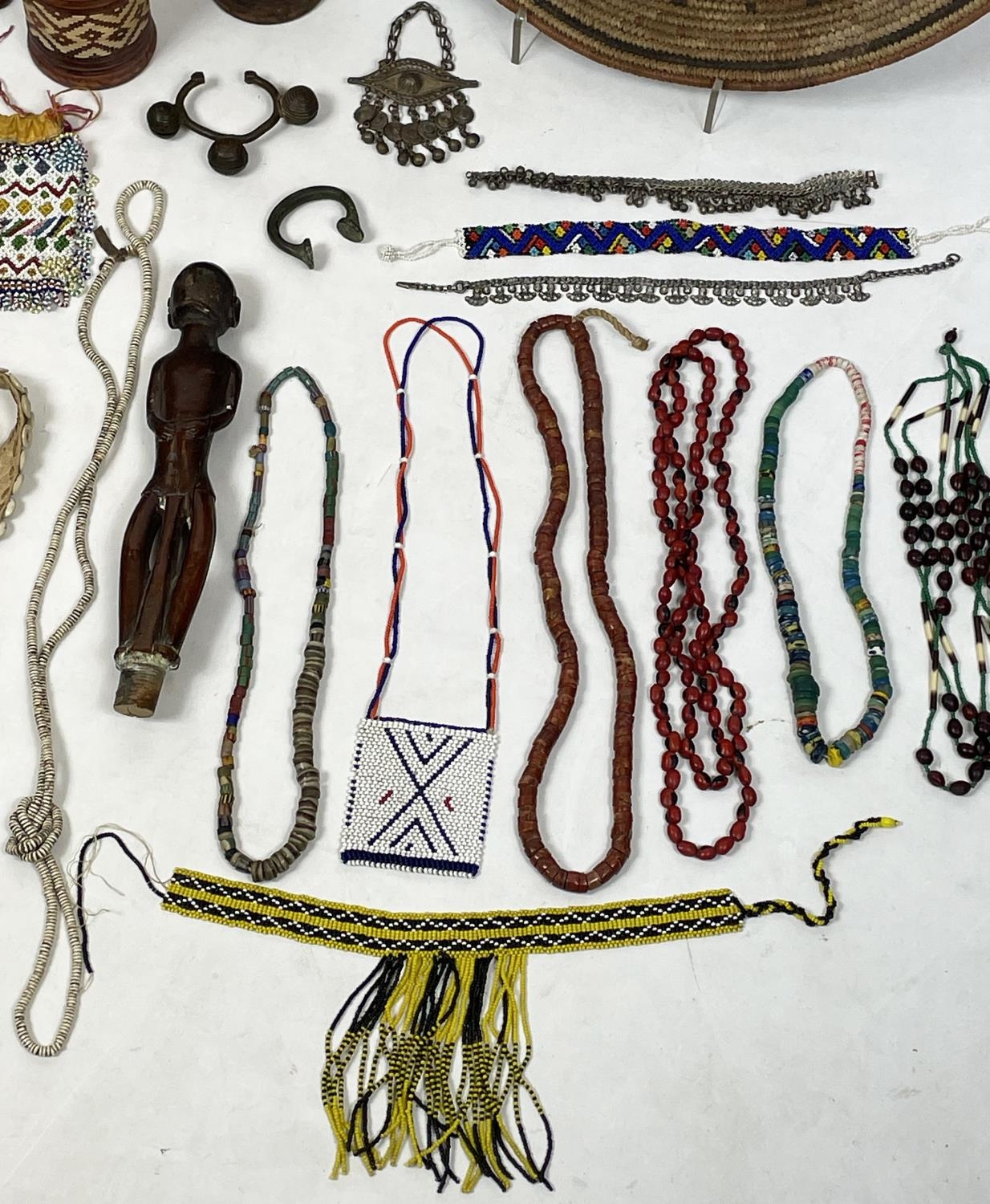 AFRICAN TRIBAL ITEMS, various including a West African bronze Manilla (money) and ankle bracelet two - Image 7 of 10