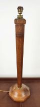 LAMP, 84cm H, in the form of a tapering fascetted oak column with brass detail.