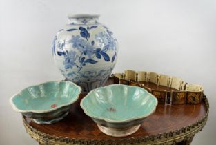 CHINESE FAMILLE ROSE BOWLS, a pair, 19th century along with a blue and white scrolling foliate