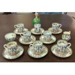 A COALPORT 'INDIAN TREE' PATTERN COFFEE SET, late Victorian, circa 1880, including eight can and