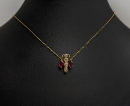 A 22CT GOLD INSECT PENDANT NECKLACE, set with round brilliant cut diamonds and oval cut rubies, 4.16