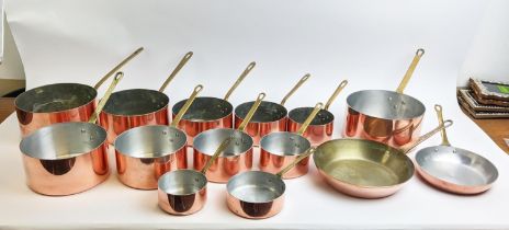 BATTERIE DE CUISINE, a set of copper pans, graduated form, including two frying pans. (14)