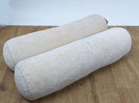 BOLSTER CUSHIONS, a pair, in a light pink fabric, 88cm x 25cm. (2)