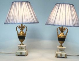 TABLE LAMPS, a pair, Neoclassical form marble, ormolu and ormolu mounted of vase form and stepped