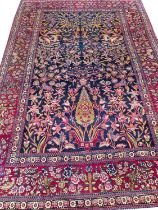 ANTIQUE PERSIAN ESFAHAN AHMAD RUG, 206cm x 136cm.