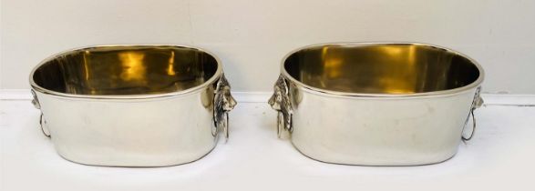 CHAMPAGNE COOLERS, a pair, 16cm high, 45cm wide, 26cm deep, lion head ring handles, polished