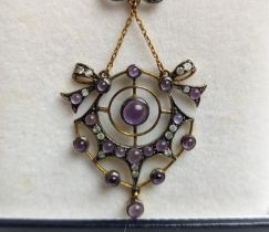 AN EDWARDIAN STYLE SILVER-GILT AMETHYST AND DIAMOND PENDANT NECKLACE, in a spider's web design, 44cm