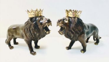 BRONZE ROARING LIONS, a pair, with gilt painted detail, 22cm H x 42cm L x 12cm W (2)