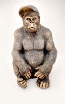 GORILLA WEARING A BASEBALL CAP, 60cm H x 40cm W x 34cm D, faux bronze finished resin.