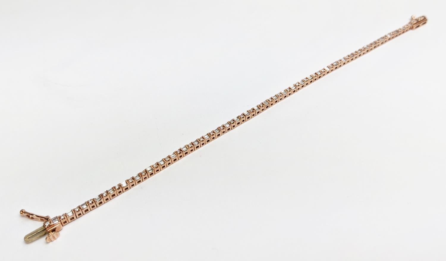 A 10CT ROSE GOLD AND DIAMOND SET BRACELET, set with alternating baguette and round brilliant cut - Image 6 of 9