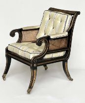 LIBRARY BERGERE BY JULIAN CHICHESTER, Regency style ebonised, gilt heightened and caned, 58cm W.