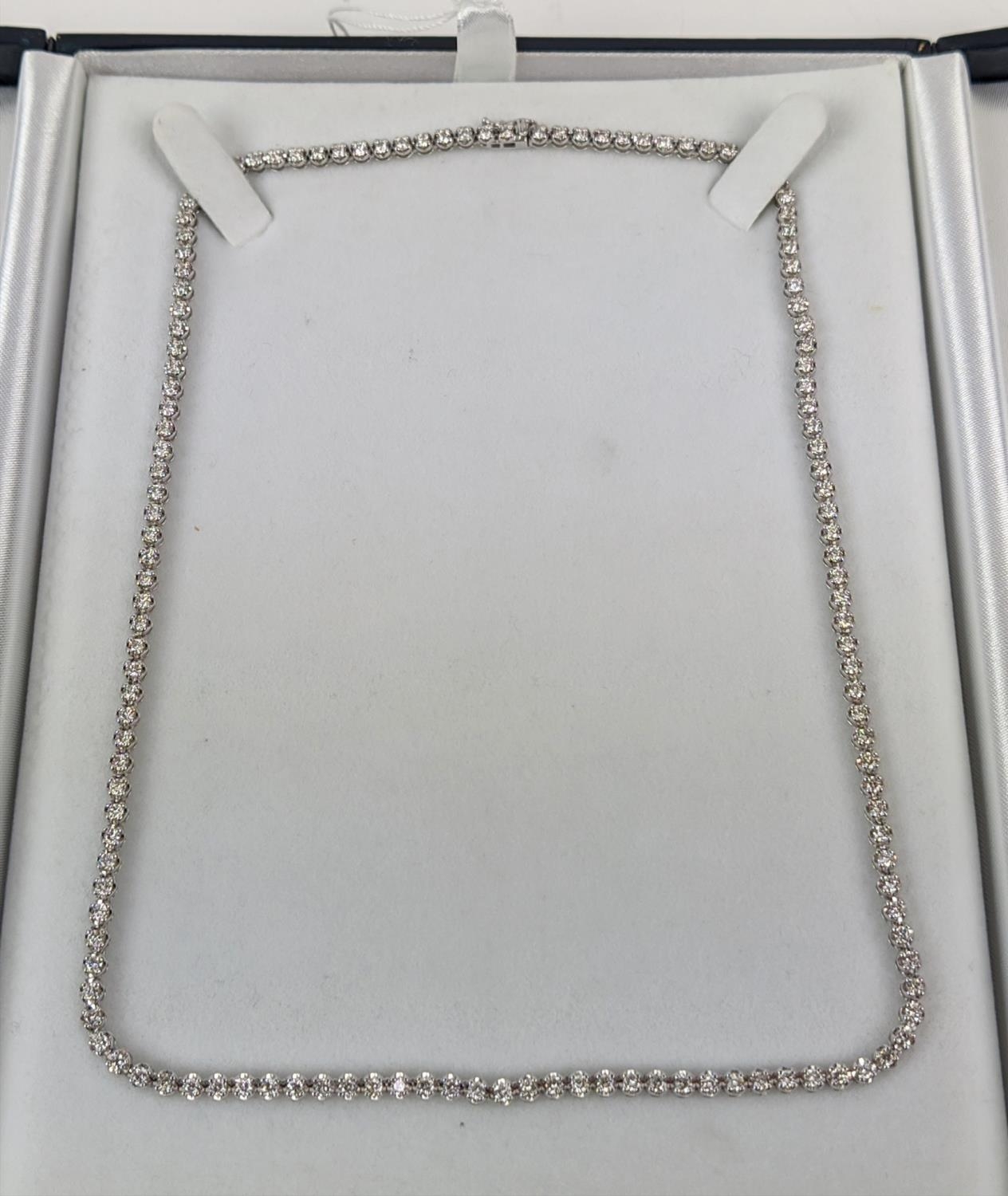 AN 18CT WHITE GOLD DIAMOND SET NECKLACE, set with approximately 140 round brilliant cut diamonds,
