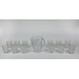 LALIQUE WATER PITCHER, frosted chene oak leaf design with twelve glasses. (13)