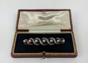 DIAMOND AND SEED PEARL BAR-BROOCH, early 20th Century, yellow metal with white metal setting,