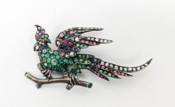 FIGURAL MULTI GEMSTONE SET BROOCH, in the form of an exotic bird on a branch, early 20th Century,