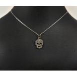 A SILVER AND DIAMOND SET SKULL PENDANT, Italian silver chain, 46cm long, complete with box.