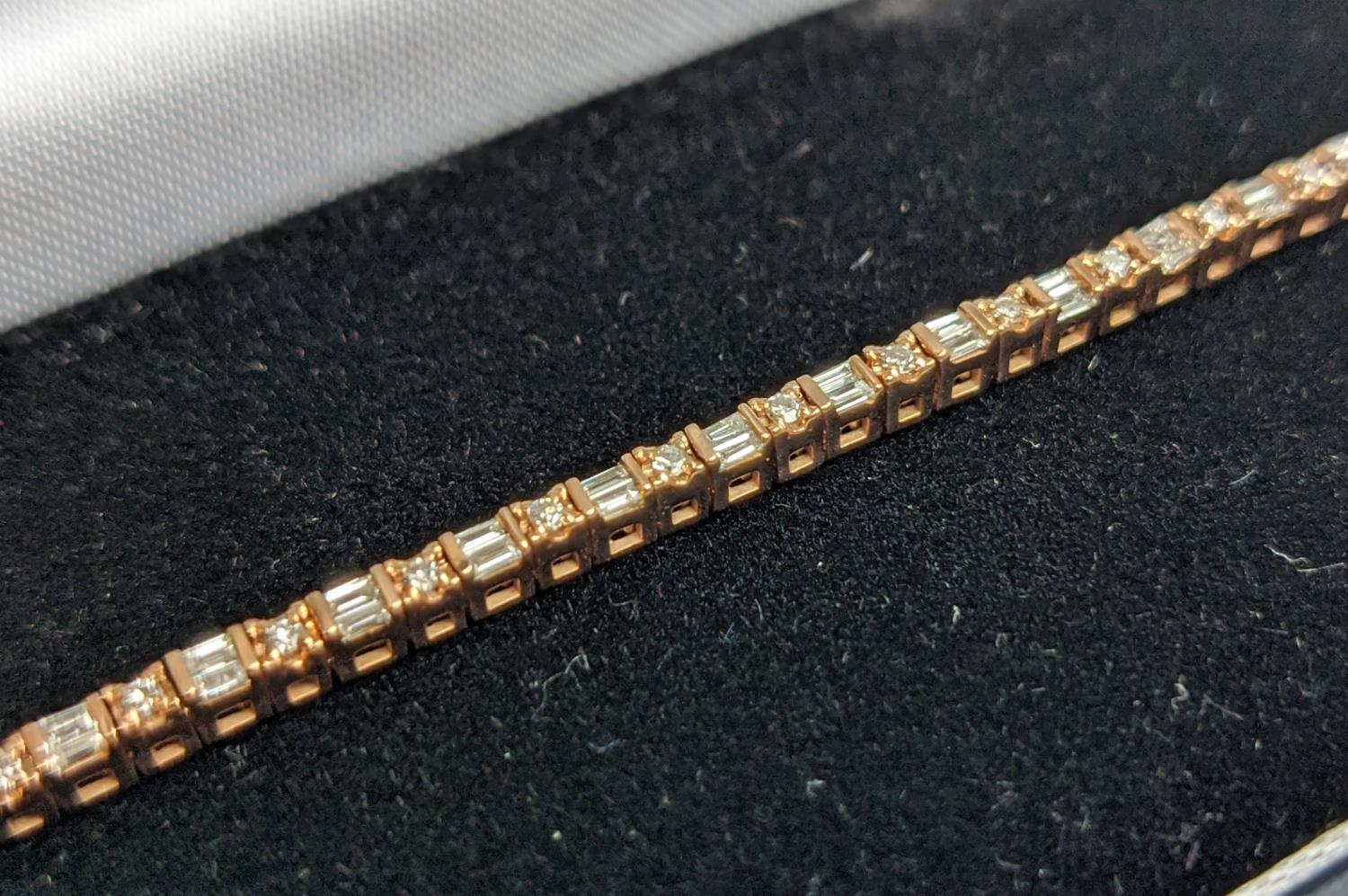 A 10CT ROSE GOLD AND DIAMOND SET BRACELET, set with alternating baguette and round brilliant cut - Image 5 of 9