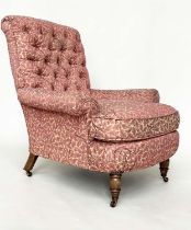 HOWARD STYLE ARMCHAIR, with button back, scroll arms, feather cushion and turned front supports