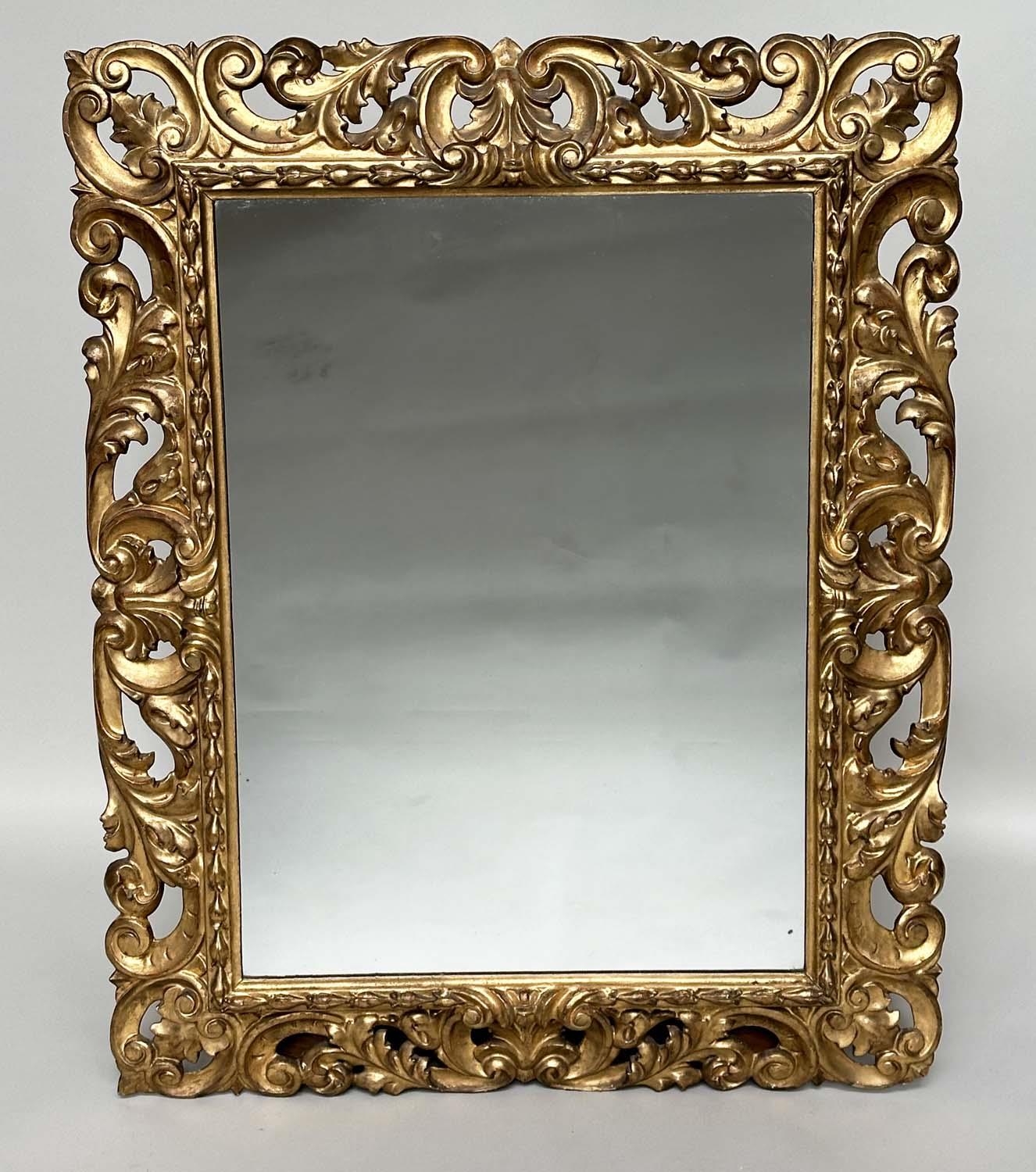 FLORENTINE WALL MIRROR, 19th century Italian rectangular carved giltwood C scroll and foliate