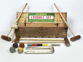 JAQUES CROQUET SET, early/mid 20th century comprising four clubs, balls, hoops, end post etc, in a