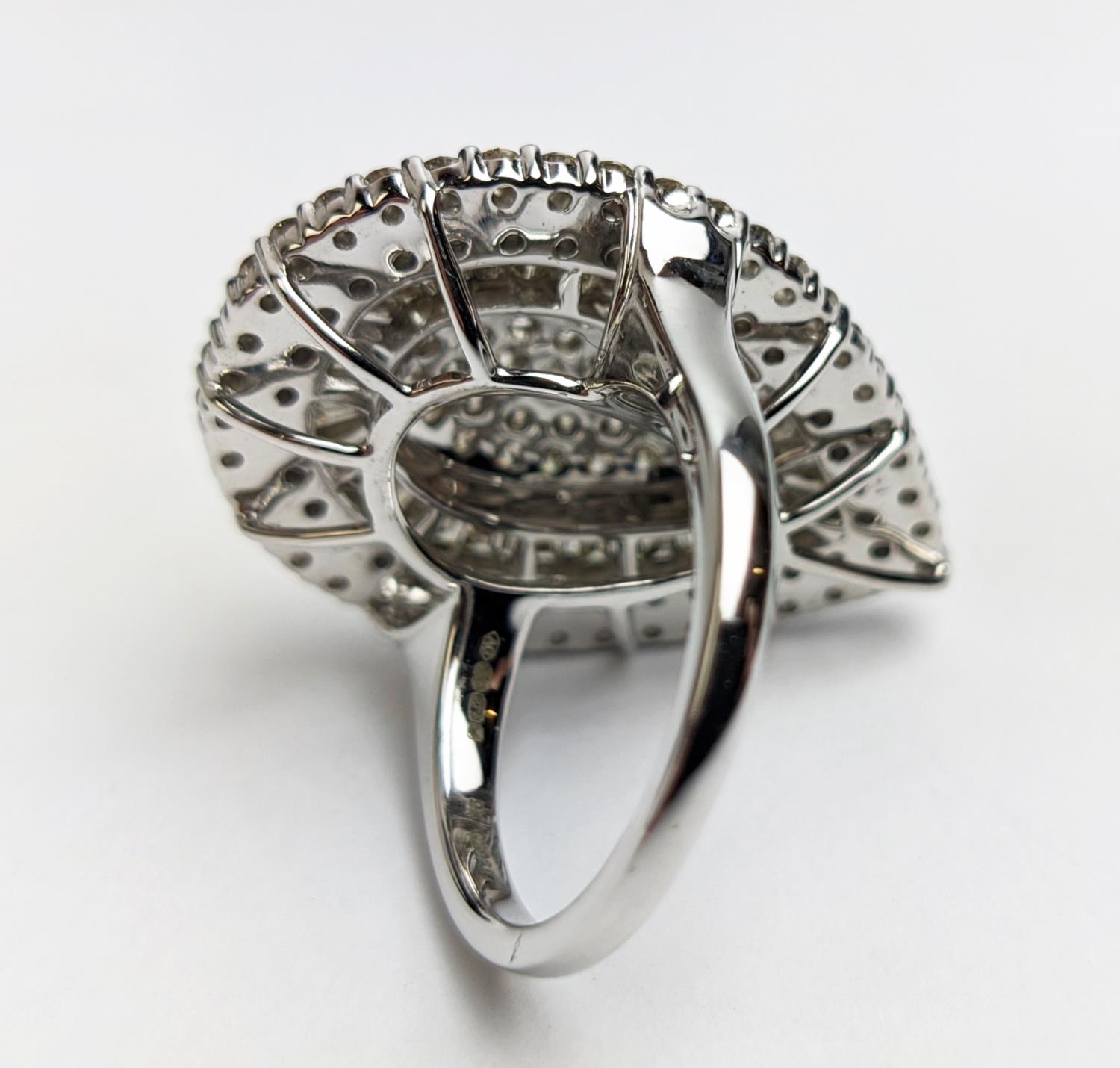 A 9CT WHITE GOLD DIAMOND CLUSTER DRESS RING, tear-drop shape, set with a baguette and round - Image 7 of 12