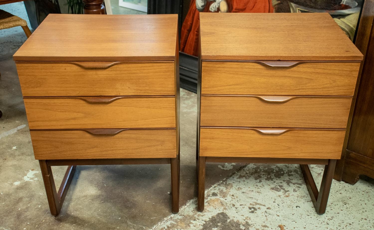 BEDSIDE CHESTS, 70cm H x 50cm W x 45cm D, a pair, circa 1970, teak, each with three drawers. (2)