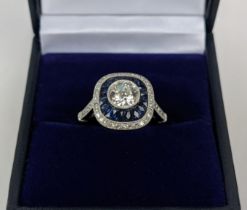 A PLATINUM AND DIAMOND SOLITAIRE RING, the central old cut stone of approximately 0.85 carats,