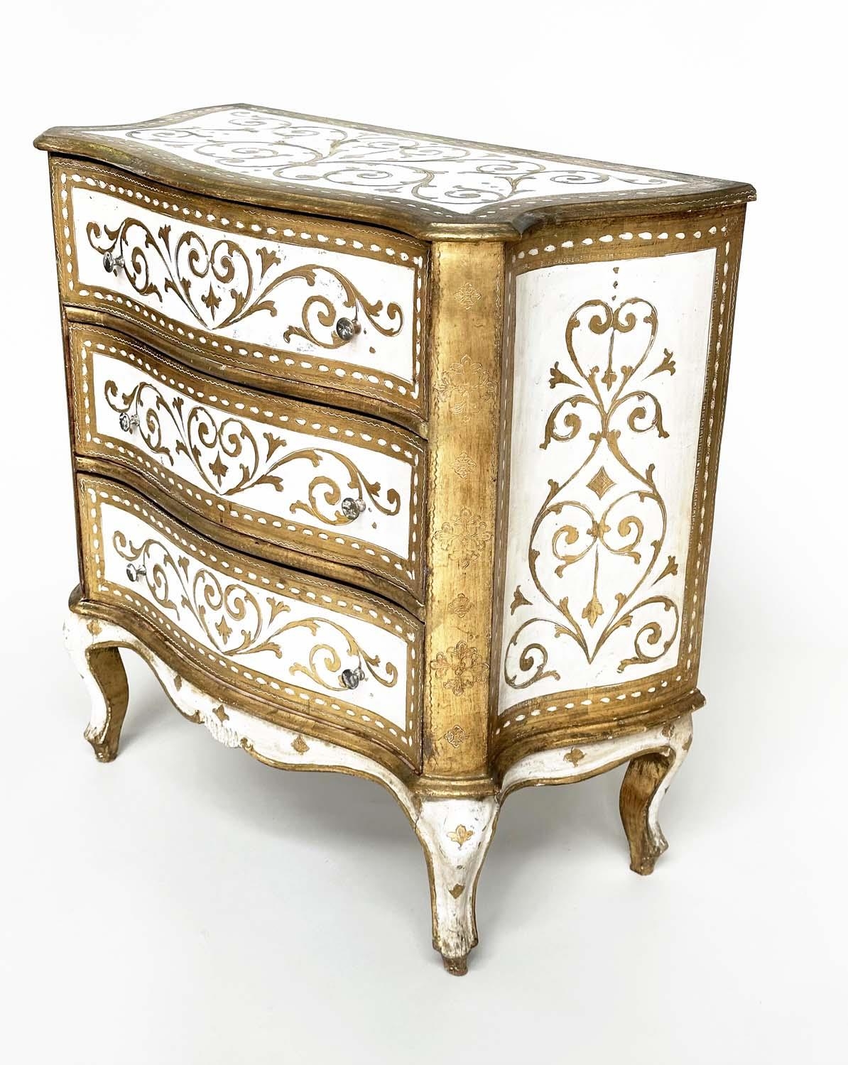 FLORENTINE COMMODE, Italian white painted and parcel gilt of serpentine form with three drawers,