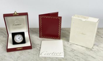 CARTIER 'PANTHERE' TRAVEL ALARM CLOCK, in black leather buttoned case in original red and gilt